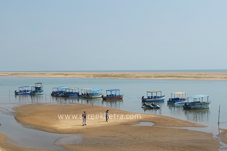 Boats on the Ramachandi sea beach