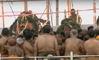 Servitors bringing water to Snana Mandapa
