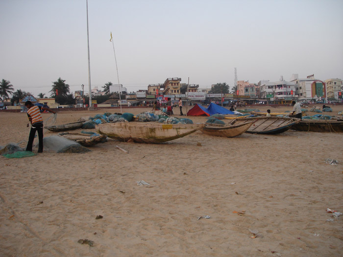 Fishermen with their Boat at Puri Sea Beach